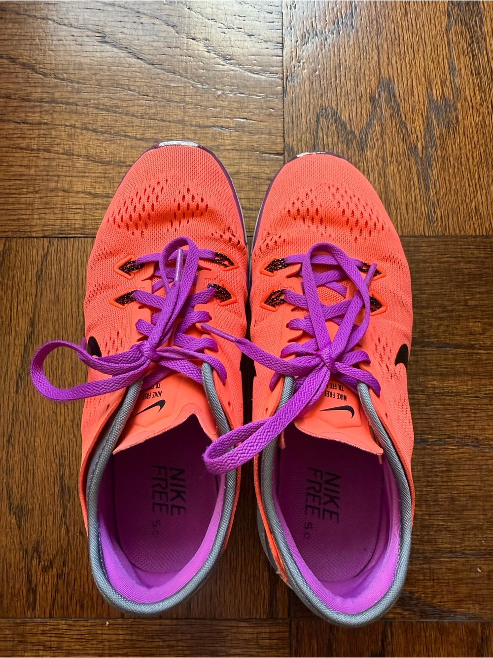 Nike Women's Running Shoes in Bright Coral with Purple Accents